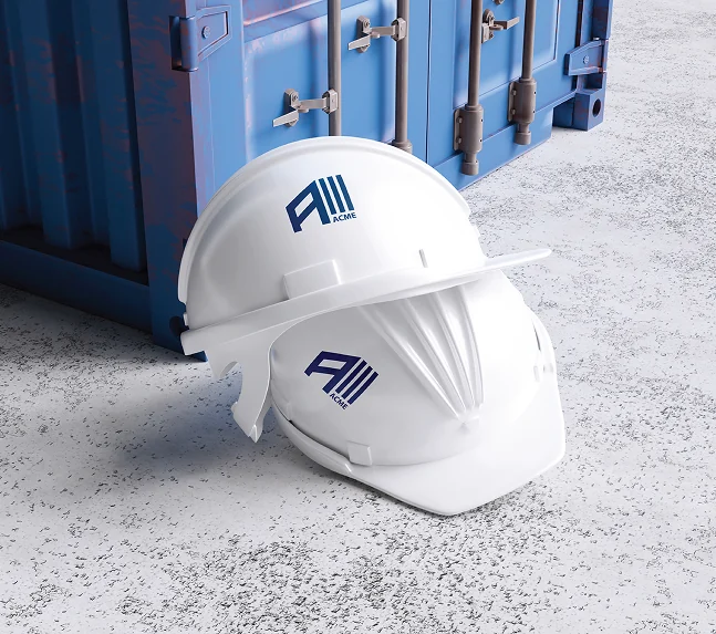 A white safety helmet with the ACME mark beside a blue shipping container