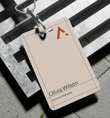 An AMK staff badge on a lanyard