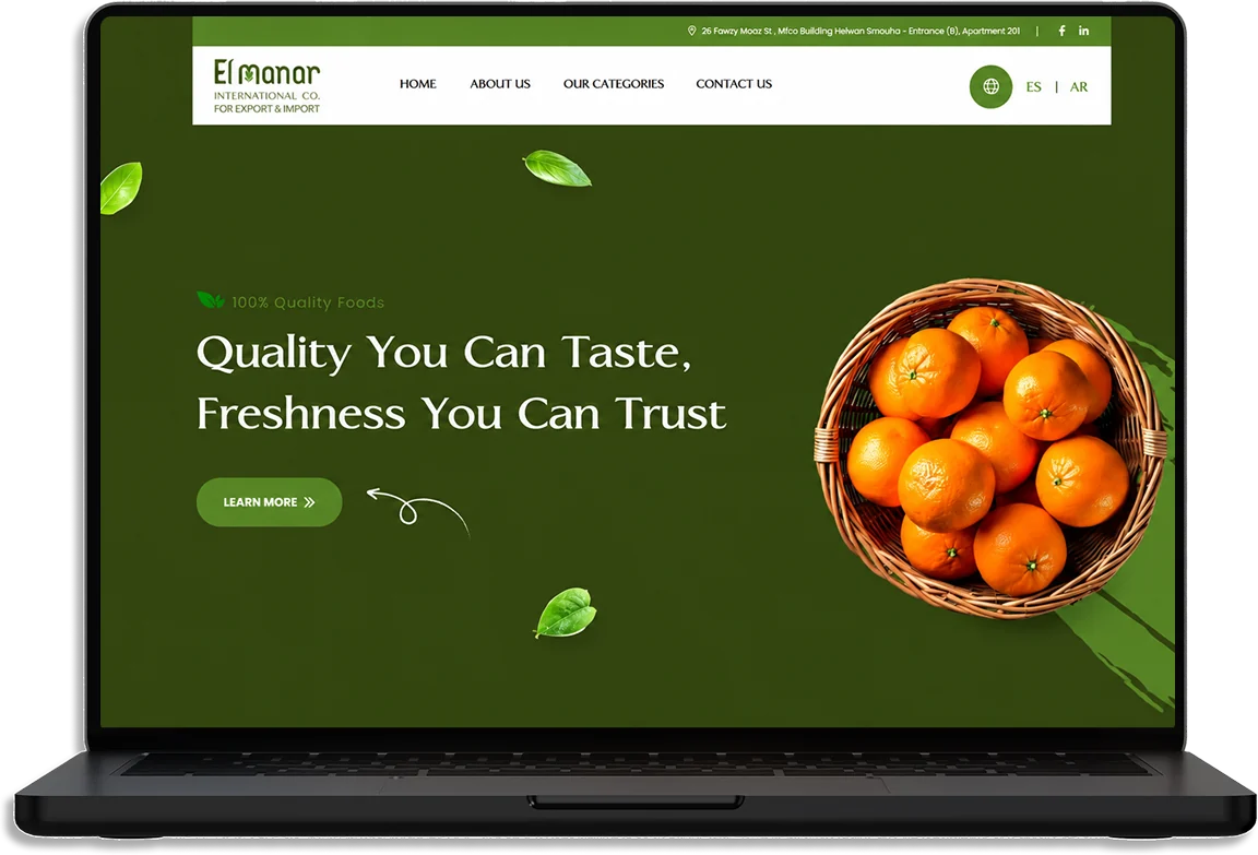 The El Manar website on a laptop: Quality You Can Taste, Freshness You Can Trust, beside a basket of oranges