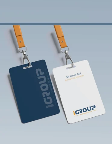 iGroup Construction staff ID cards on orange lanyards