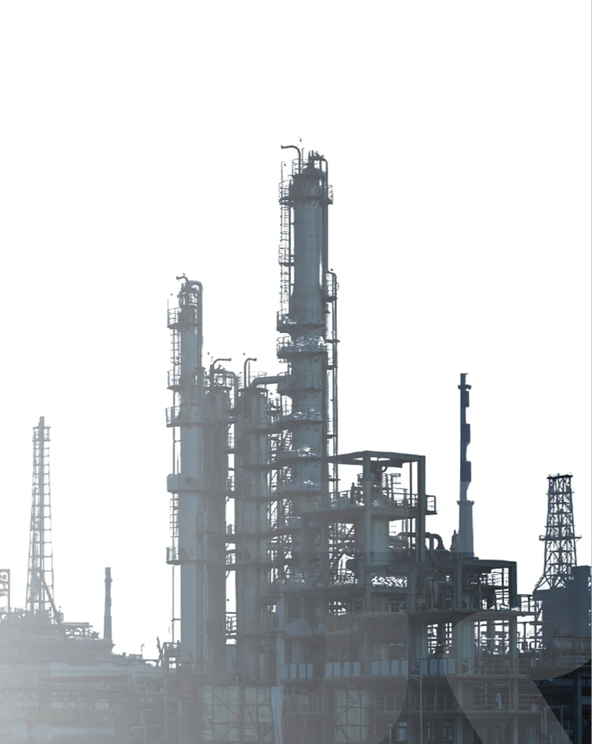 An industrial plant's towers and pipework against a pale sky, the iGroup mark on its structure