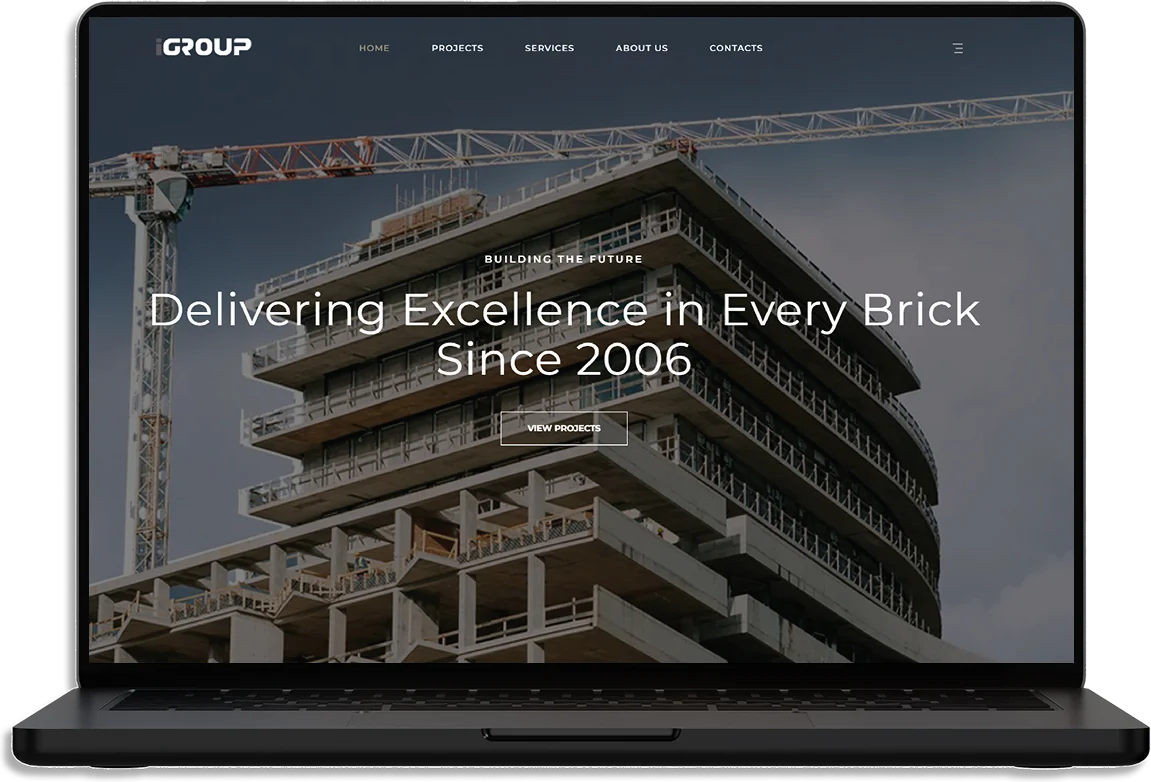 The iGroup Construction website on a laptop: a building under construction under Delivering Excellence in Every Brick Since 2006