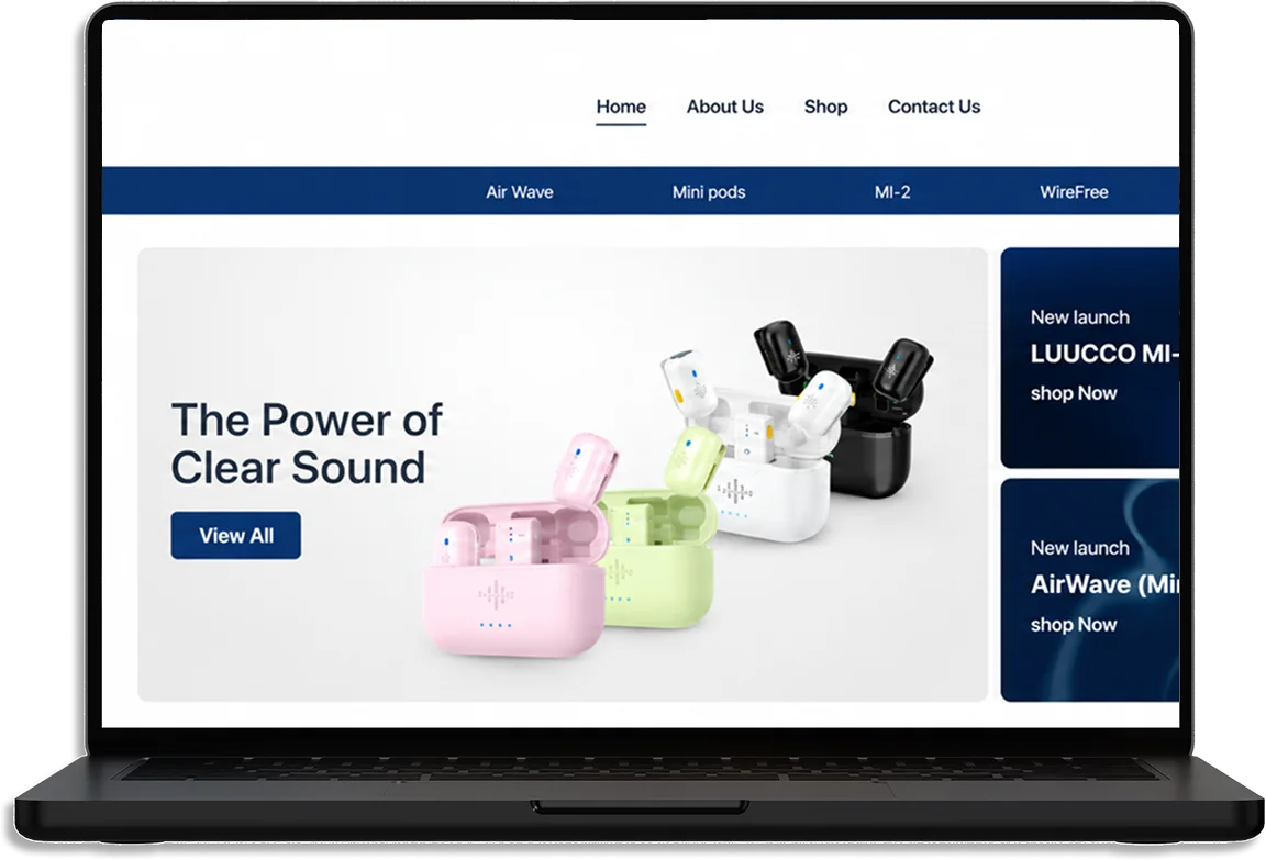 The Tech1Mart website on a laptop: wireless microphone cases in pink, green, white and black under The Power of Clear Sound, with new launches beside them